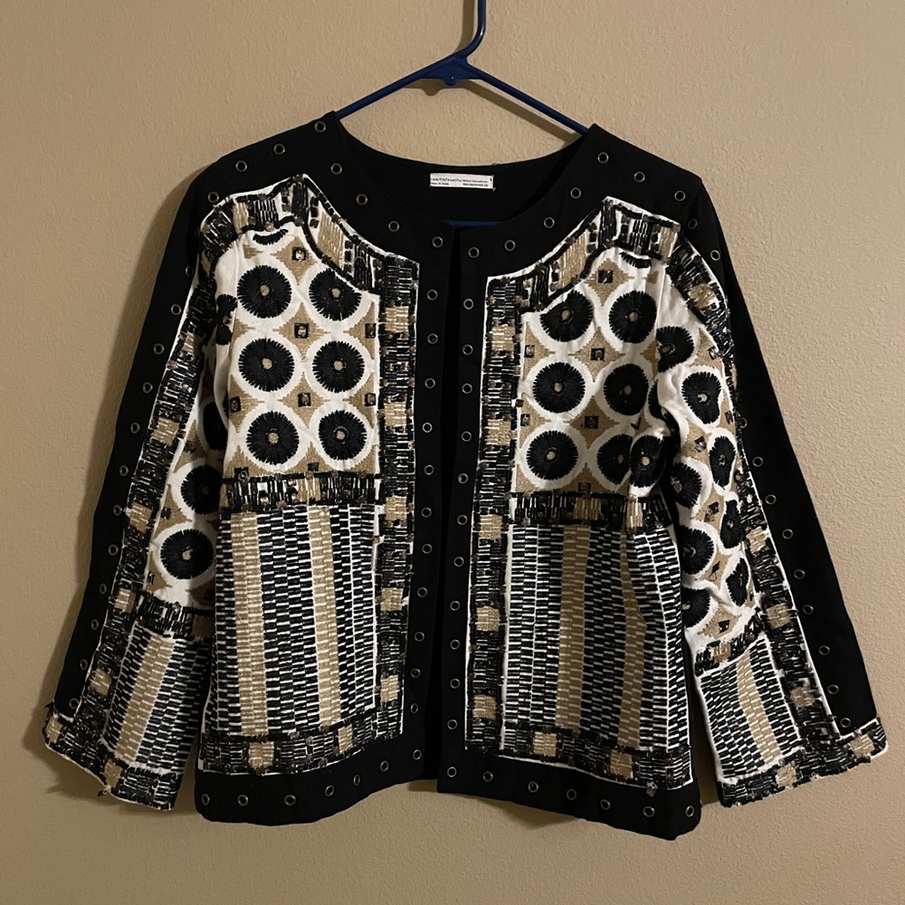 Beaded jacket without closures.